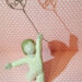 A figure of a boy holding a balloon with the word 'hope' in it.