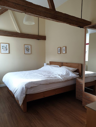 The second bedroom with a king size bed, bedside cabinet, wardrobe and dressing table in it.