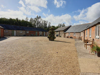The gravel courtyard between the cottages and other cottage buildings.