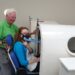Hannah going into the hyperbaric oxygen therapy chamber. She has an oxygen mask on her face.