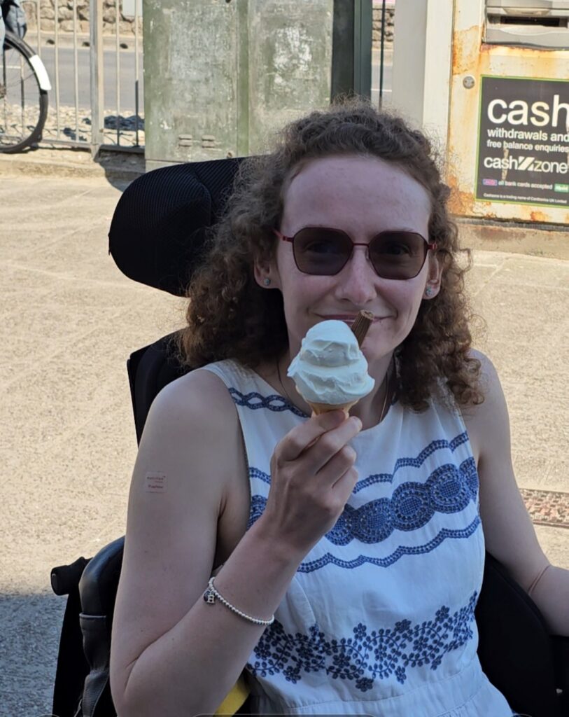 Hannah having a Rossi's ice cream. One of five wheelchair accessible things to do in Weymouth.