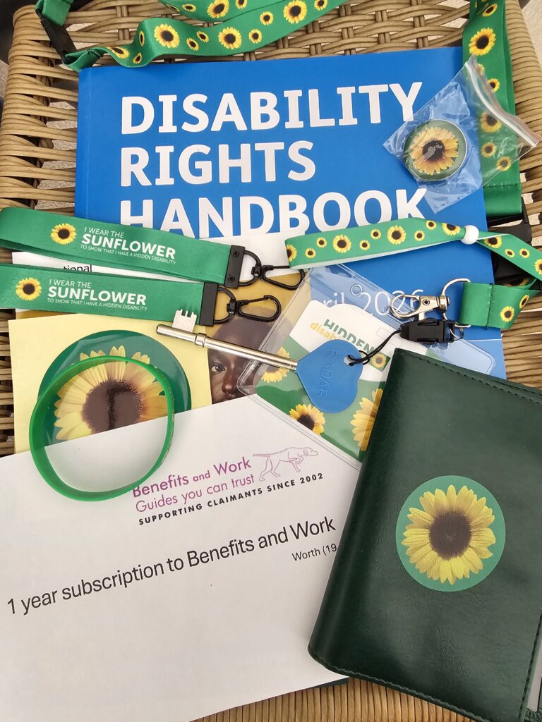 Product giveaway! A disability rights UK handbook, Benefits and Work annual subscription and collection of Sunflower hidden disability goodies.
