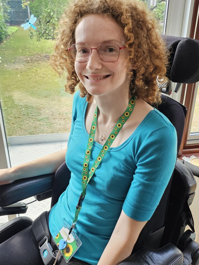 Hannah wearing the Hidden Disabilities- Sunflower lanyard.